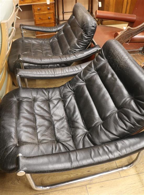 A pair of 1950s leather chairs